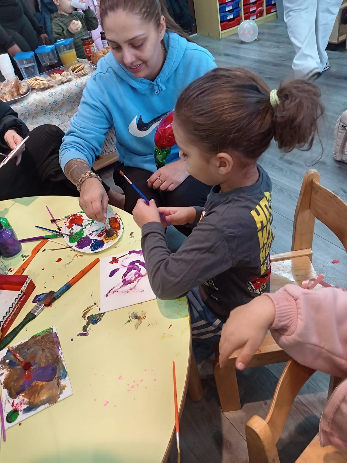 Children taking part in a hands-on table activity